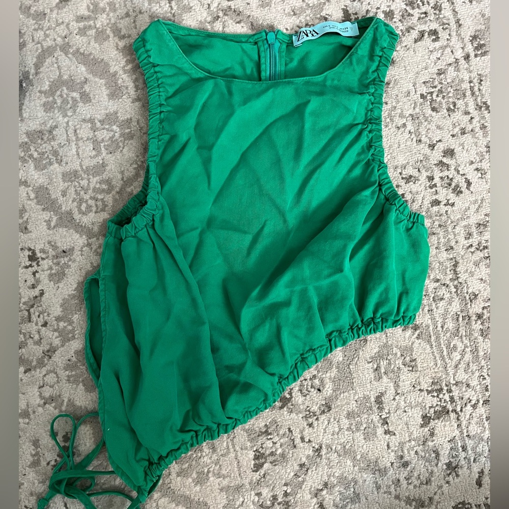 Green, slanted crop top. Great for going out. Never worn!